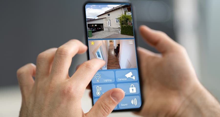 Homeowner looking at surveillance camera footage on a smartphone